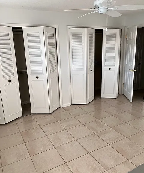 Primary bedroom with double closets and a linen closet just outside the door. Enjoy the refreshing eastern ocean breeze year-round, perfect for sleeping with the windows open in spring and fall.