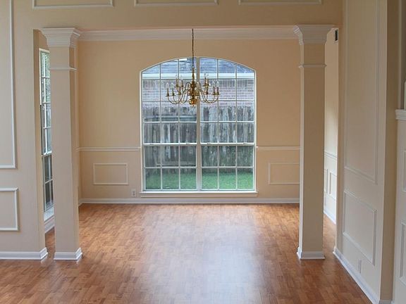 New laminate wood flooring in the formal living & dining area.  Freshly painted throughout.  Design crown molding that really makes a great color scheme.