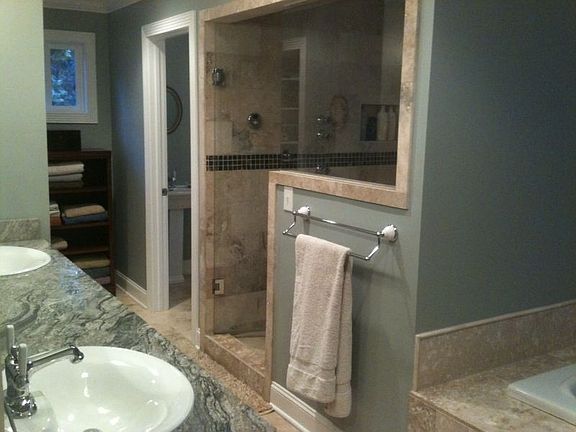Master Bath with travertine floors, granite tops, jacuzzi tub, steam shower