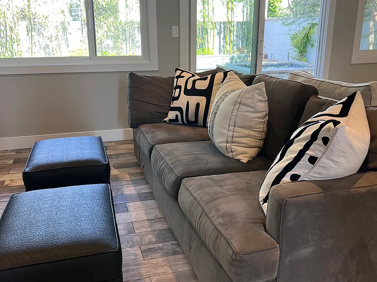 Downstairs living room opens up to backyard and pool