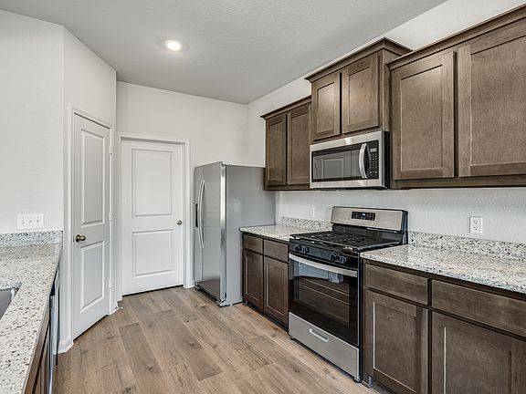 The kitchen has beautiful granite countertops.
