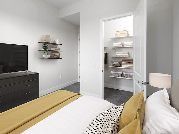 Signature Collection bedroom apartment with custom closet shelving system