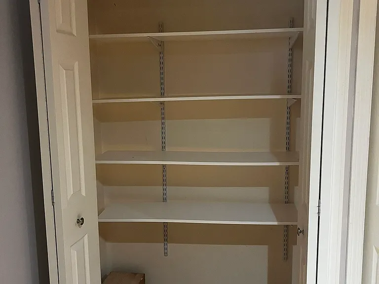 shelving system in bonus room closet 1 of 2