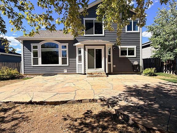 View of back yard & flagstone patio