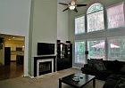 spacious living room with gas switch fireplace