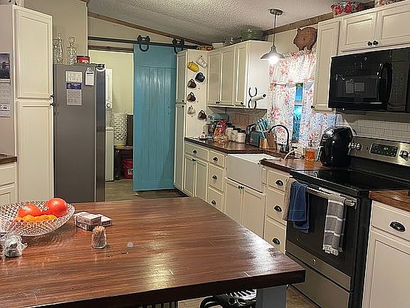 Facing kitchen from dining a