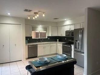 Kitchen will rolling island. Large pantry for storage.