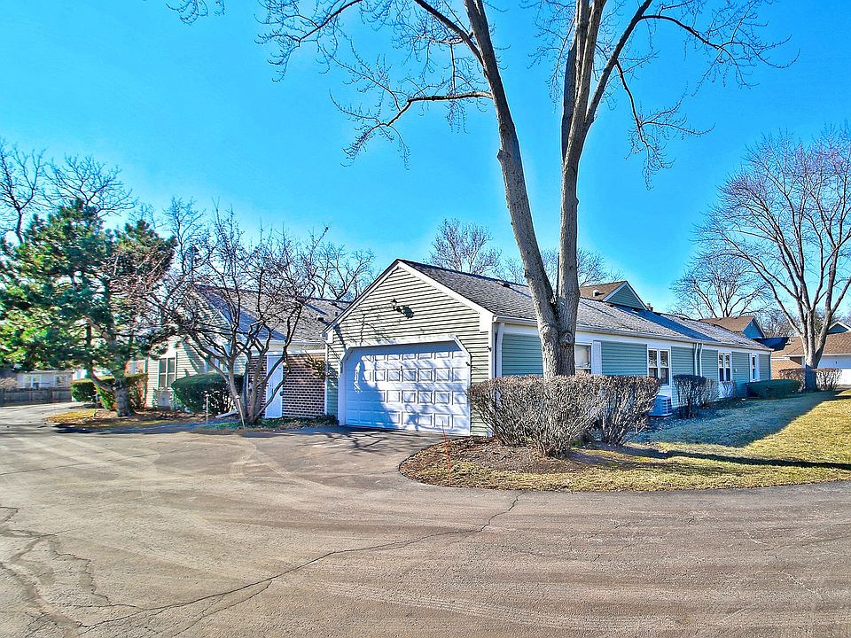 THE HOME FRONT. END UNIT.GOOD PARKING. 2 CAR GARAGE. AND VIEW OF LARGE POND