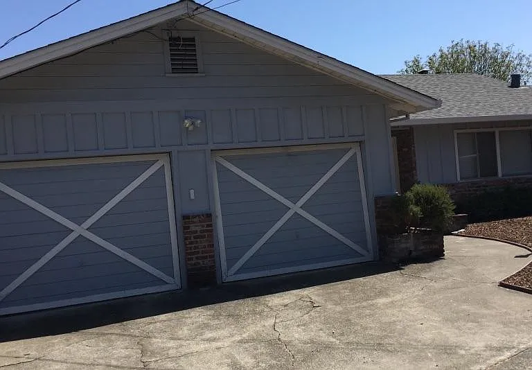2 car garage with driveway spaces