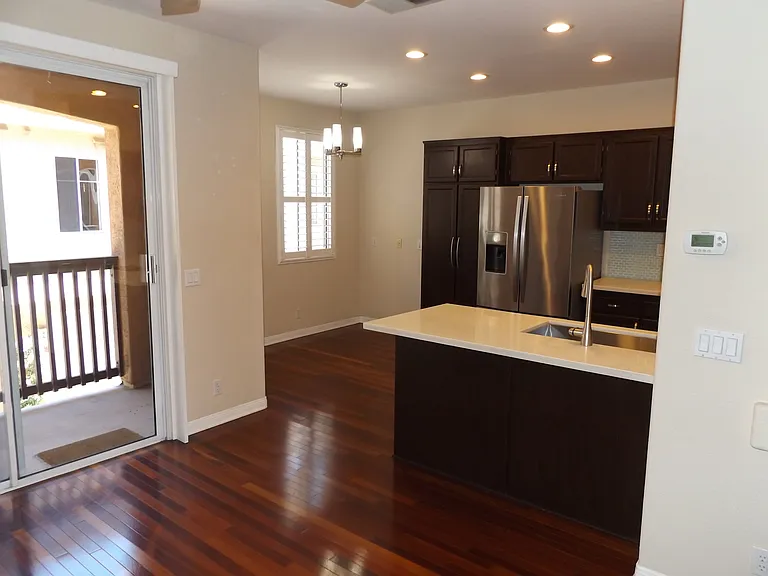 Rear portion of kitchen with pantry storage adjacent to breakfast nook or office space