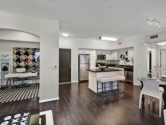 Gorgeous High End Features Connect this Kitchen, Dining, and Living Room