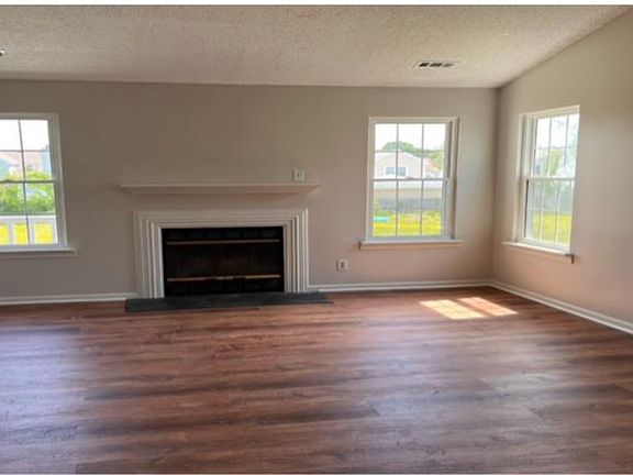Open living room with a fireplace