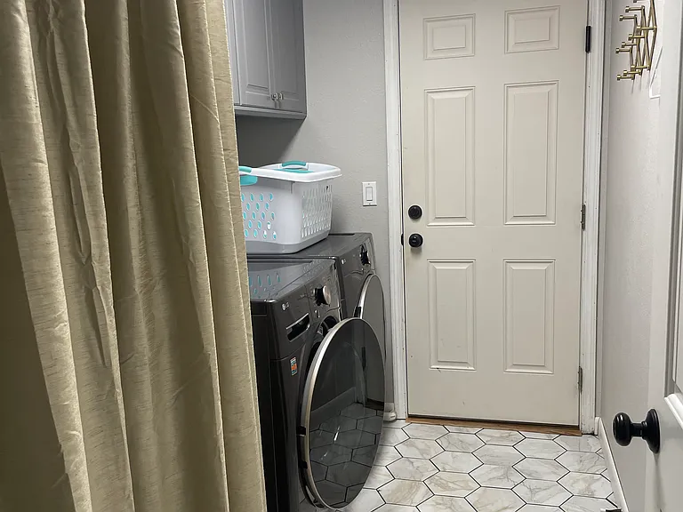 Newly remodeled laundry room with new washer and dryer.