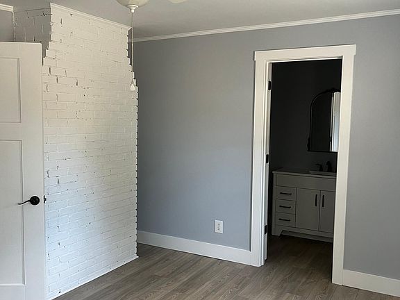 Master bedroom has exposed brick