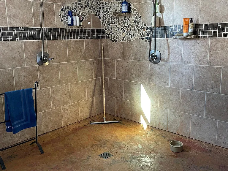 downstairs bathroom with dual shower and heated floor