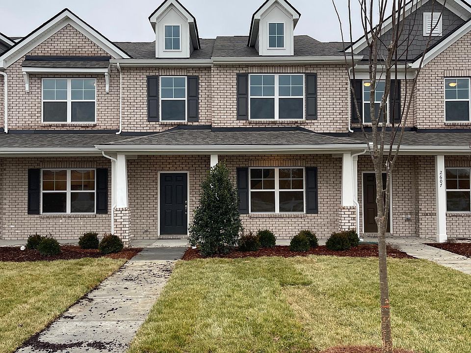 Enjoy the front porch of this BRAND NEW townhome