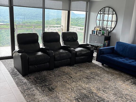 Living room and view with auto blinds.