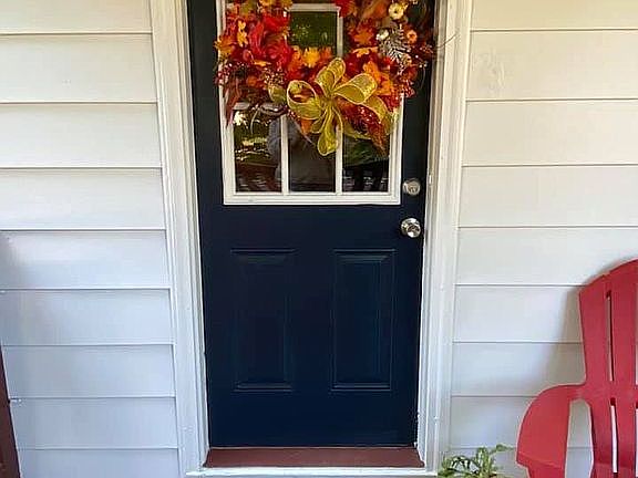 Side door cement porch view