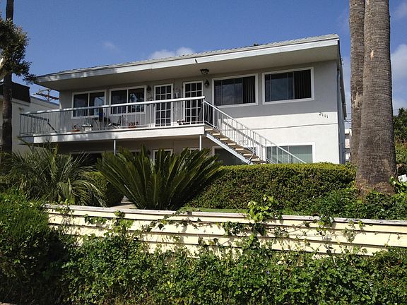 FOUR UNIT COMPLEX WITH OFF STREET PARKING IN REAR.