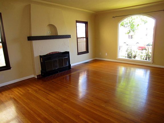 Beautiful hardwood floors throughout living room and dining
