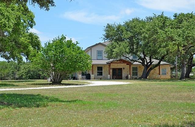 Acreage estate less than 22 miles northwest of Downtown Austin in the coveted Lake Travis school district