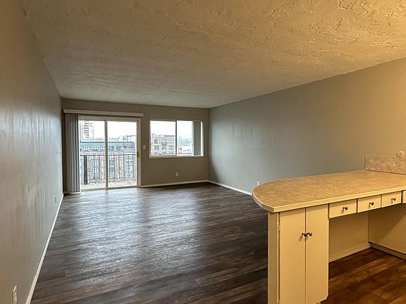 View of living room and kitchen from the hallway