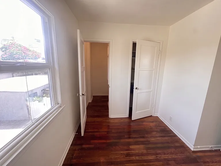 walk in closet and side closet in master bedroom