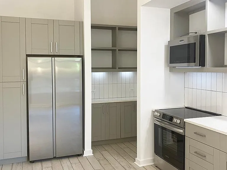 Cooks kitchen with room for dining or island.