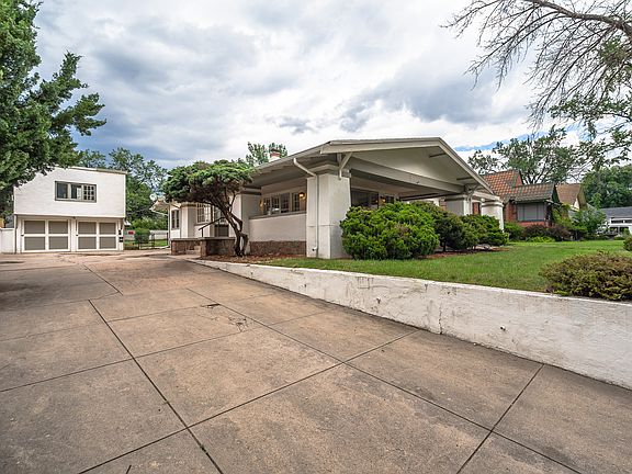 Side of house, long driveway, garage