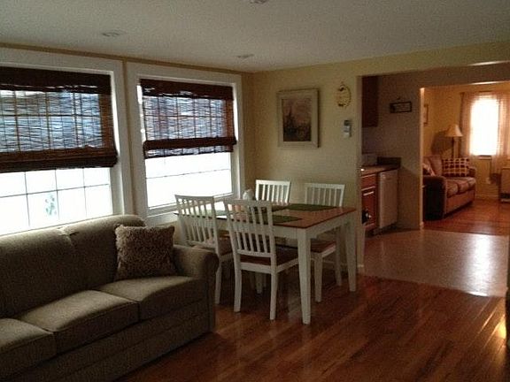 Sunroom with another sleeper sofa, washer/dryer and dining t