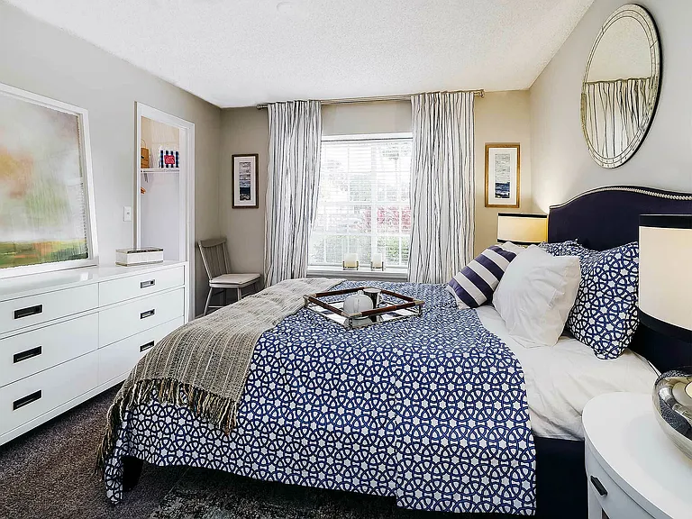 Experience a blend of comfort and style in this beautifully decorated bedroom, perfect for relaxation.