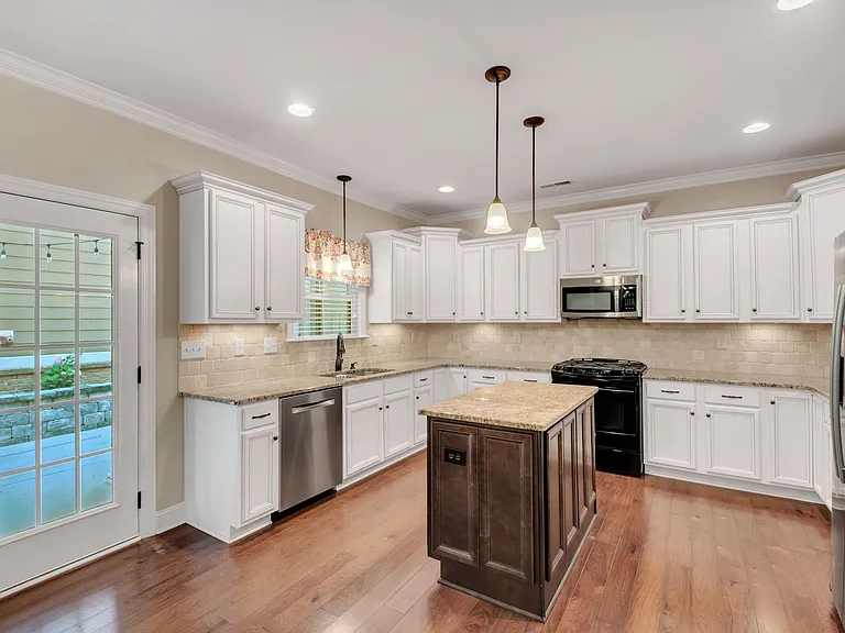 Spacious kitchen includes dishwasher and island
