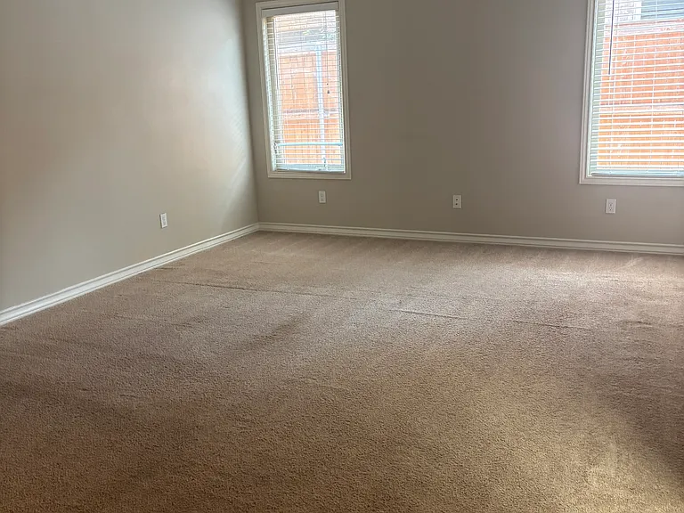 Master bedroom in downstairs area with large walk-in closet and master bath