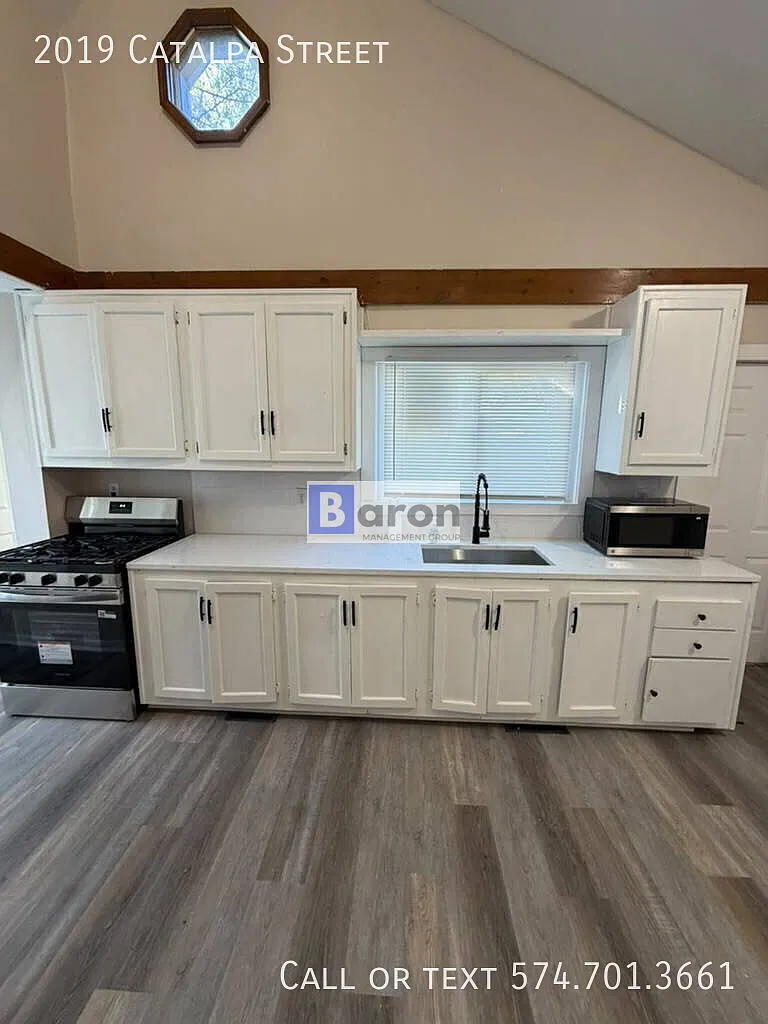 "Charming 4-Bed Home with Gleaming Hardwood Floors at 2019 Catalpa St, South Bend!" — Photo 4