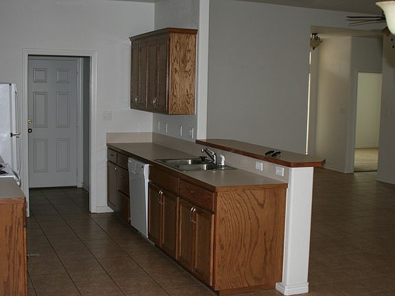 Dining to Kitchen, Utility, Garage