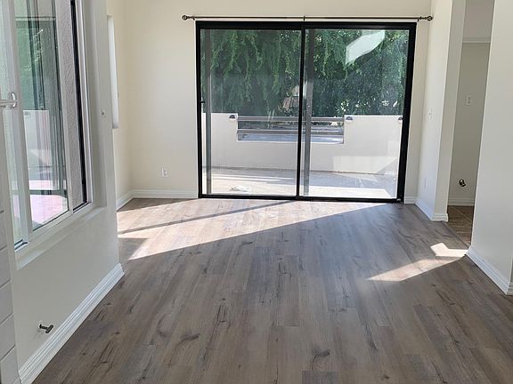 Living Room Area leading to Dining Area - New flooring