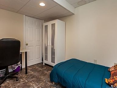 Additional room in the finished basement can be used as an office or bedroom.