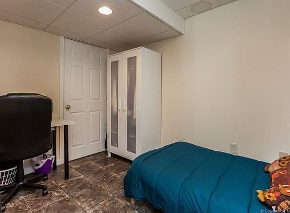 Additional room in the finished basement can be used as an office or bedroom.