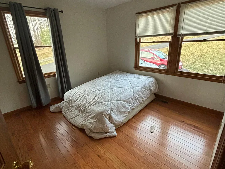 Downstairs bedroom with a full sized air mattress for size comparison