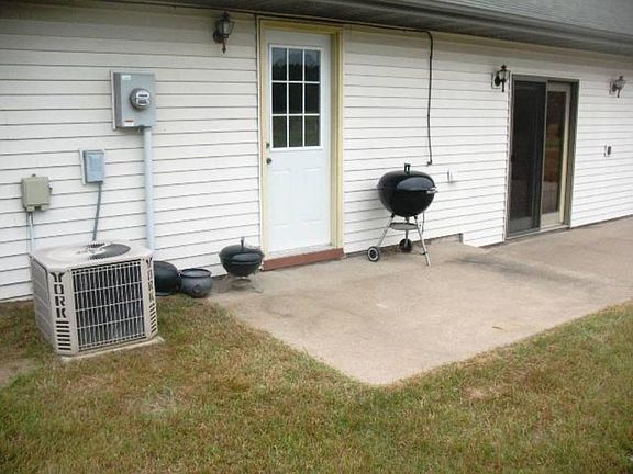 Back yard patio. Home includes a central unit forced air conditioning system.