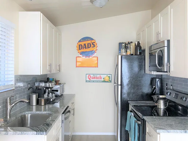Full kitchen remodel with stainless steel appliances - Dishwasher, Range, Microwave, Fridge. Beautiful Granite counter tops, back splash and cabinets