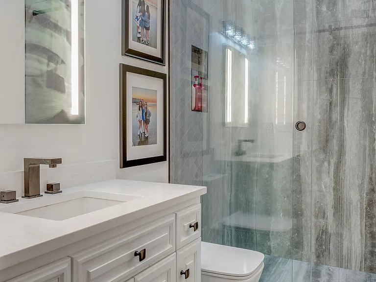 Custom designed, 2nd full bath on suite to 2nd bedroom first floor.