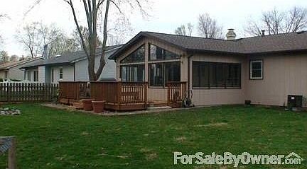 Living Room with Gas Fireplace
						:
						This room features a natural gas fireplace. Opens into the kitchen and sunroom.