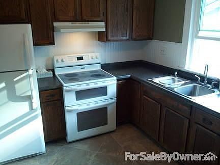 Kitchen : Tile floor, double over and stove, refrigerator, new countertops