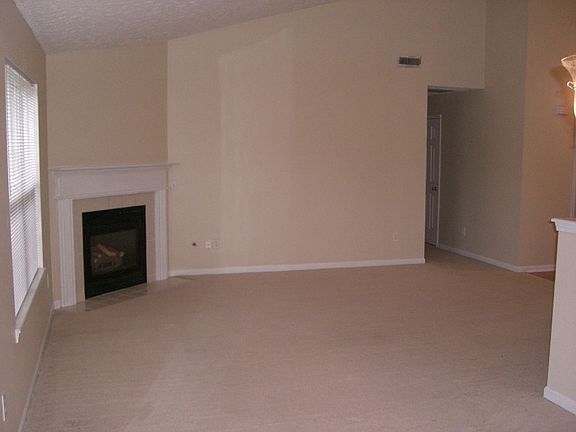 Open great room with vaulted ceilings and gas fireplace