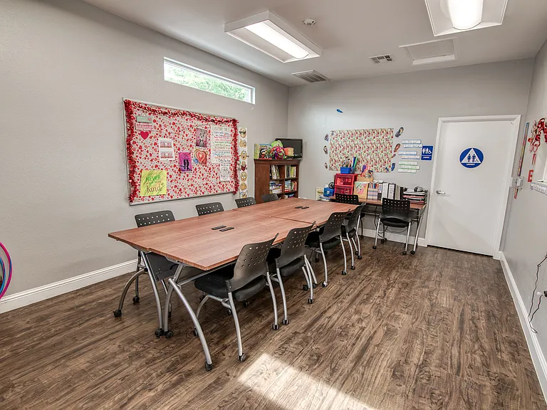 Community learning room with colorful decor and activities for kids.