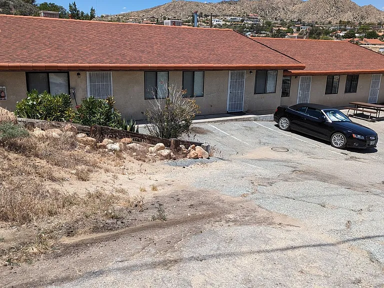 Front of the building showing parking spaces.