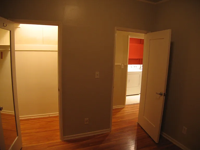 Bedroom and closet in 200 facing laundry beyond.