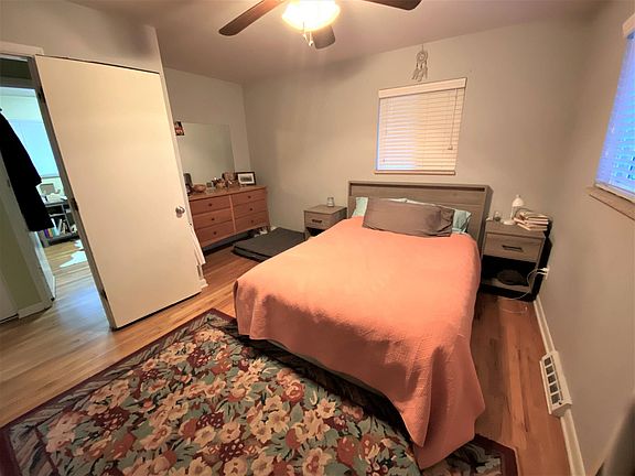 Primary bedroom upstairs, which has a view of the flatirons from the window pictured. The other two upstairs bedrooms are across the hallway.