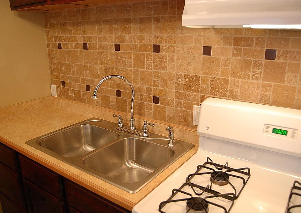 Double-sided, stainless steel sink w disposal. Full size ga